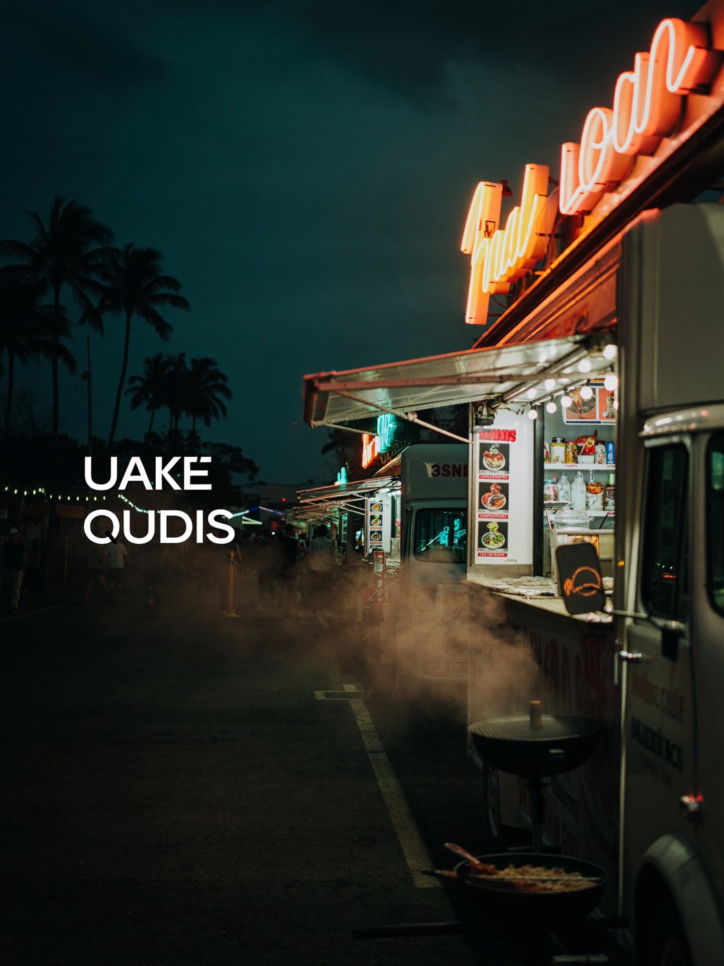 A food truck glowing with neon at a night market
